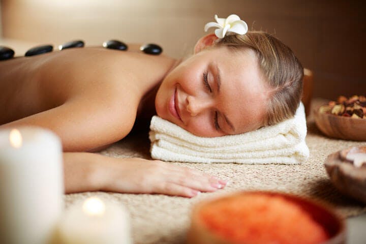 Image of a women having hot stone massage